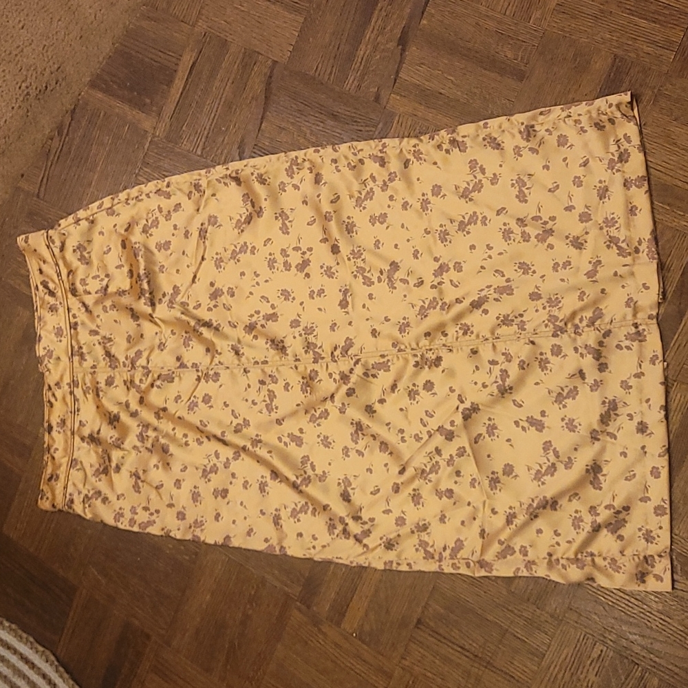 Adorable gold skirt with brown floral print.